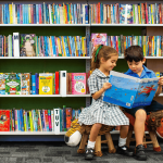 Two students from St Patrick’s Catholic Primary School Summer Hill reading books in the library and on their way to 2025 NAPLAN results success A photo showing two students from St Patrick's Catholic Primary School Summer Hill reading books in the library and on their way to 2025 NAPLAN results success
